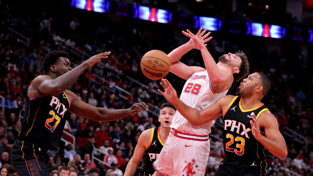 Rockets center Alperen Sengun is fouled by Phoenix Suns guard Eric Gordon (23) on a drive to the basket during the second quarter at Toyota Center.